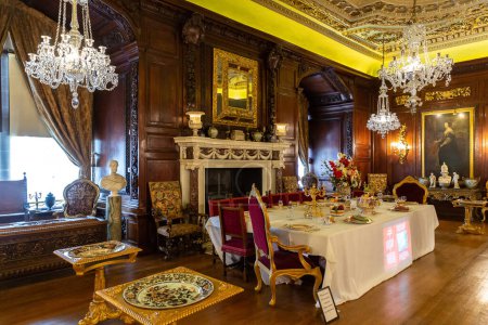 Photo for WARWICK, UK - JUNE 11, 2022: Dining room and Interior of Warwick Castle - is a medieval castle built by William the Conqueror in 1068, UK - Royalty Free Image