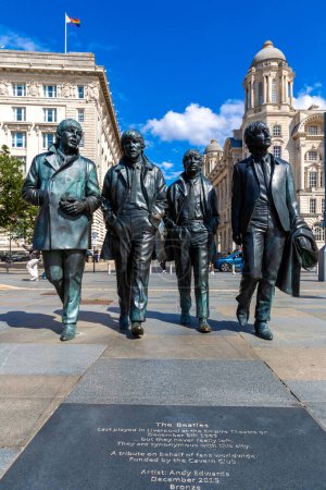 Photo for LIVERPOOL, UK - AUGUST 16, 2023: The Beatles Statue in Liverpool stands at the Pier Head on the side of river Mersey in a sunny day, United Kingdom - Royalty Free Image