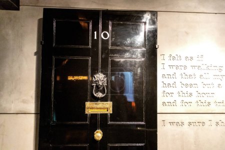 Photo for LONDON, UK - SEPTEMBER 8, 2023: Original oak door to 10 Downing Street - office Britain's prime ministers in Churchill War Rooms of the Imperial War Museum in London, England, UK - Royalty Free Image