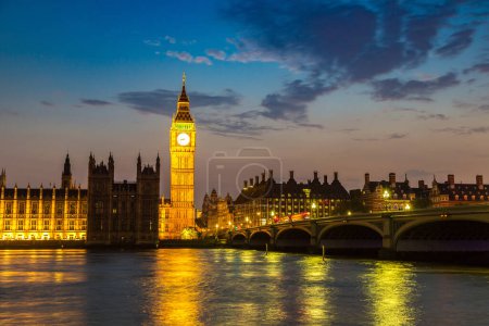 Photo for The Big Ben, the Houses of Parliament and Westminster bridge in London in a beautiful summer night, England, United Kingdom - Royalty Free Image