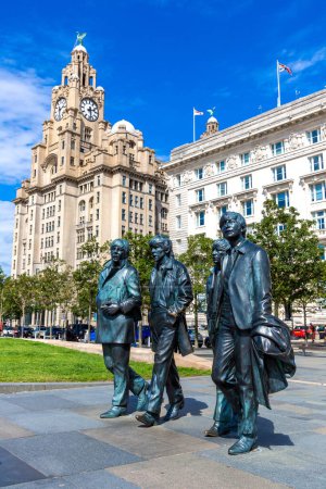 Photo for LIVERPOOL, UK - AUGUST 16, 2023: The Beatles Statue in Liverpool stands at the Pier Head on the side of river Mersey in a sunny day, United Kingdom - Royalty Free Image