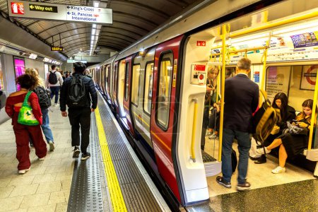 Photo for LONDON, UK - SEPTEMBER 26, 2023: People are traveling on underground metro train. Interior of underground wagon in London, England, UK - Royalty Free Image