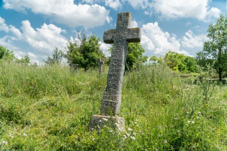 Photo for Old abandoned cemetary with burials of the Cossacks in Busha state Historical and Cultural Reserve, located in Busha village on Podillya, Vinnytsa region, Ukraine. Travel destinations in Ukraine on  Podillya. - Royalty Free Image