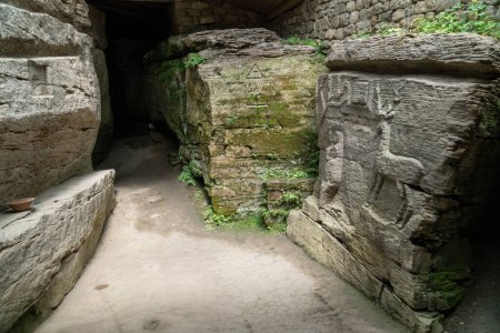 Photo for Busha, Ukraine - july 25, 2021:  Stone temple cave at Busha state Historical and Cultural Reserve, located in Busha village on Podillya, Vinnytsa region, Ukraine, 2021. Travel destinations in Ukraine on  Podillya. - Royalty Free Image