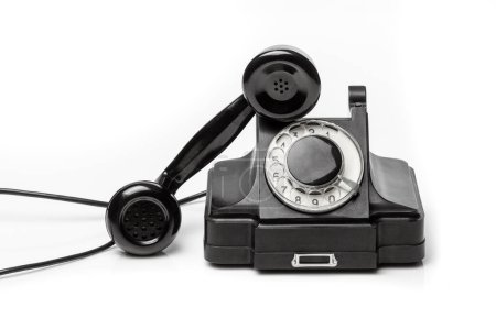 Foto de Teléfono negro vintage en un bachground blanco. Tecnología de telecomunicaciones conept - Imagen libre de derechos