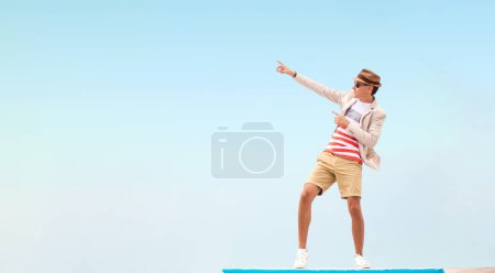 Photo for Design for Poster with Mall Advertisement. Man Showing on Copy Space. Smiling Guy on Ads Template for Clothing Promote. Mockup with Free Space for Text - Royalty Free Image