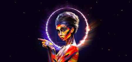 Foto de A girl in a glowing neon circle. Woman in color body painting on her face. Design for a nightclub or mall poster. Download a photo for a layout with discounts, promotions, announcements - Imagen libre de derechos