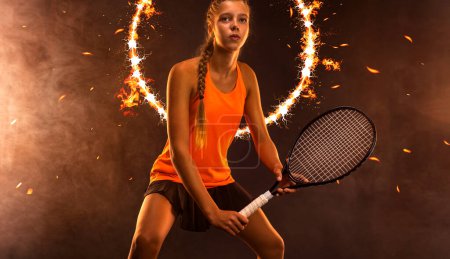 Téléchargez les photos : Tennis player. Download a photo for an advertising layout on the theme of sports and tennis.. Girl athlete teenager with racket. Sport concept - en image libre de droit