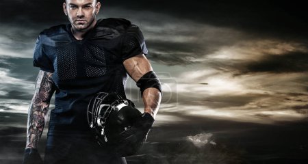 Photo for American Football player on stadium with smoke and lights. - Royalty Free Image