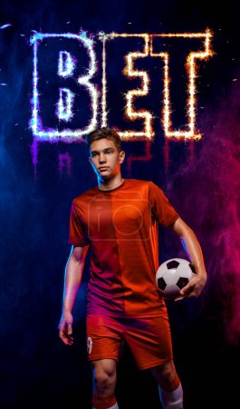 Photo for Socccer concept. Sports betting on football. Design for a bookmaker. Download banner for sports website. Soccer player on a fiery backgroun - Royalty Free Image
