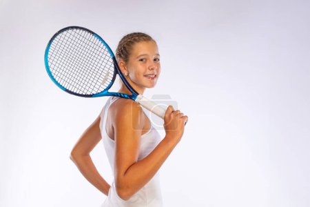 Photo for Tennis player. Download a photo to advertise your sports tennis academy for kids. Girl athlete teenager with racket isolated on white background. Sport concept - Royalty Free Image