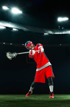 Photo for Lacrosse player, athlete. Download photo for sports betting advertisement. Website header. Sports design in neon glow.Sport and motivation wallpaper - Royalty Free Image