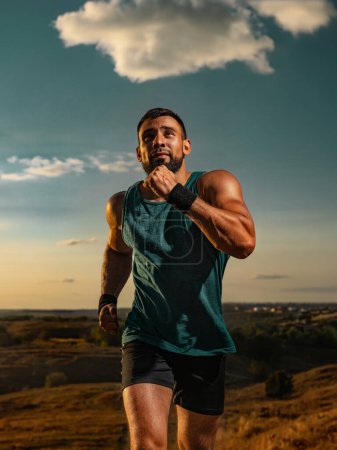 Photo for Trail run. Athlete sprinter outdoor. Athletic man running on sunset wearing in the sportswear. Fitness and sport motivation. Runner concept - Royalty Free Image