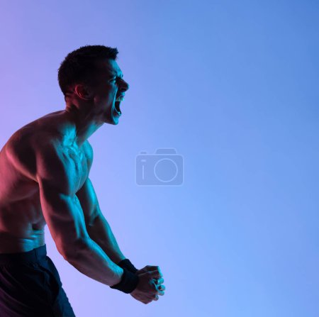Photo for Street fighter fighting in boxing gloves. Isolated on neon background with copy Space. Action shot. Sport concept. - Royalty Free Image