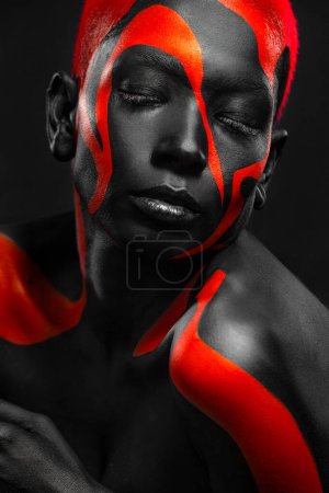Photo for The Art Face. How To Make A Mixtape Cover Design - Download High Resolution Picture with Black and yellow body paint on african woman for your Music Song. Create Album Template with Creative Image - Royalty Free Image