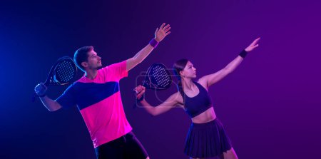 Photo for Tennis player with racket. Girl teenager athlete with racket on court with neon colors. Sport concept. Download a high quality photo for the design of a sports app or betting site - Royalty Free Image