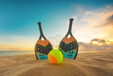 Photo for Beach tennis rackets. Sport court and balls. Download a high quality photo with paddle for the design of a sports app or social media advertisement - Royalty Free Image