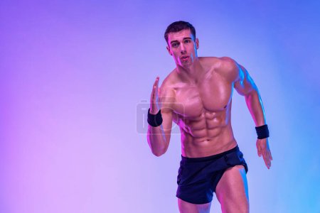 Runner concept. Athlete sprinter running on blue background. Fitness and sport motivation. Trail run