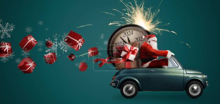 Photo for Christmas is coming. Santa Claus on toy car delivering New Year 2024 gifts and countdown clock at blue background with fireworks - Royalty Free Image