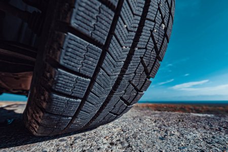 Photo for Car tire on stone close-up view - Royalty Free Image