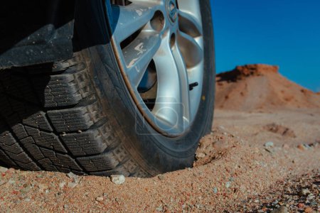 Photo for Car wheel on sand close-up view - Royalty Free Image