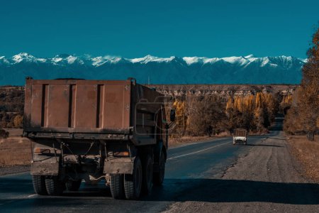 Photo for Old trucks on a road in the mountains - Royalty Free Image