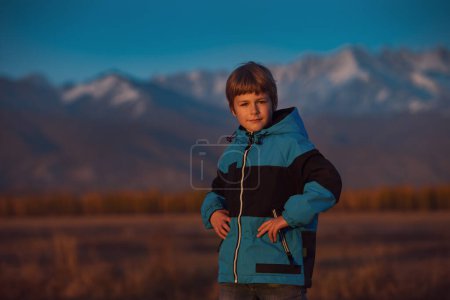 Photo for Portrait of a boy on mountains background in autumn - Royalty Free Image