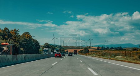 Photo for View of the highway and field with wind turbines - Royalty Free Image