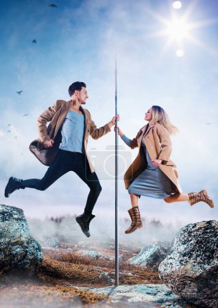 Photo for Young man and woman pole dancers in casual autumn clothing jumping, creative concept - Royalty Free Image