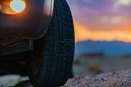 Photo for Car wheel offroad closeup view at twilight - Royalty Free Image