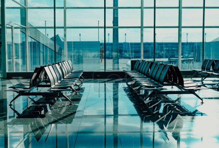 Photo for Empty airport terminal lounge, blue tint - Royalty Free Image