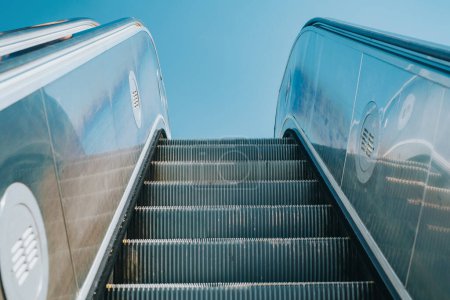 Photo for Modern outdoors escalator on blue sky background - Royalty Free Image