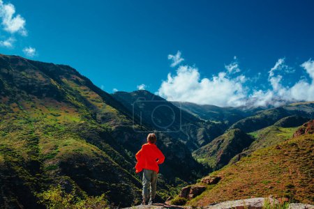 Photo for Boy hiker standing on mountains valley back view - Royalty Free Image
