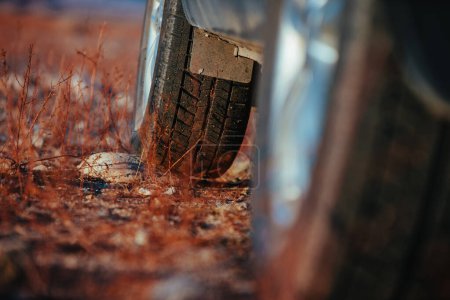 Photo for Car wheel standing on stone close-up view - Royalty Free Image