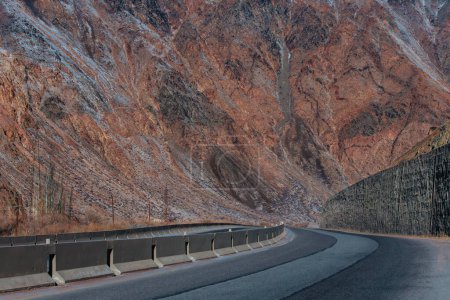 Photo for Highway road in a mountain gorge in winter - Royalty Free Image