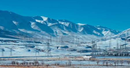 Photo for Electric power station in the mountains in winter - Royalty Free Image