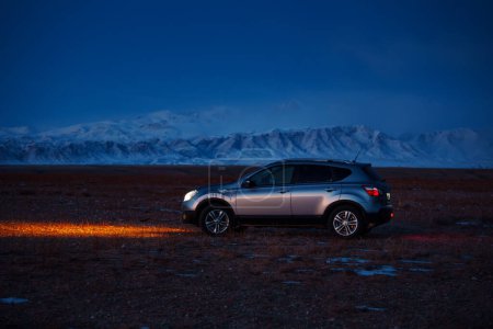 Photo for Nissan Qashqai car on mountain background at night time - Royalty Free Image