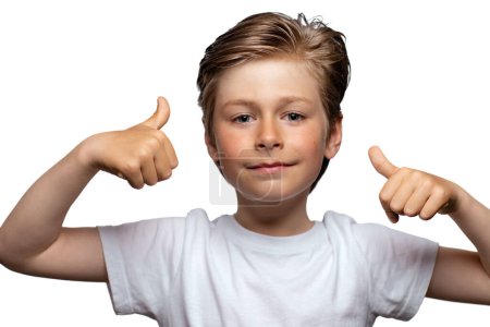Foto de Portrait of handsome boy giving thumbs up isolated on white background - Imagen libre de derechos