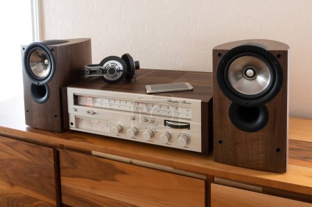 Photo for Home Stereo Receiver with Speakers and Headphones Placed on Wooden Retro Shelf. Includes Phone as a Source, New and Old Technology Working Together. - Royalty Free Image