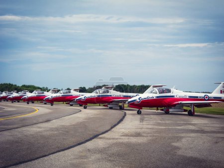 Photo for Ontario, Canada - JUNE 16, 2018 - Royal Canadian Air Force aerobatics flight demonstration team Snowbirds aircraft lined up on the ground near by London, Ontario. Air Demonstration Squadron Snowbirds aircraft waiting for Airshow opening. - Royalty Free Image