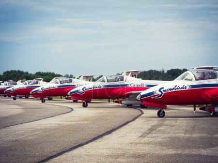 Photo for Ontario, Canada - JUNE 16, 2018 - Royal Canadian Air Force aerobatics flight demonstration team Snowbirds aircraft lined up on the ground near by London, Ontario. Air Demonstration Squadron Snowbirds aircraft waiting for Airshow opening. - Royalty Free Image
