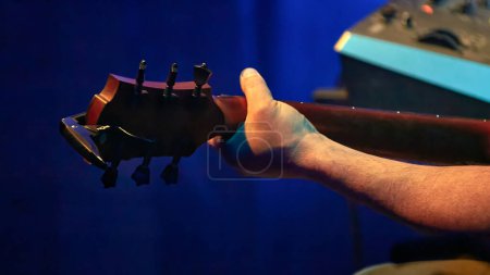 Photo for Image of a guitarists hand on a guitar neck - Royalty Free Image