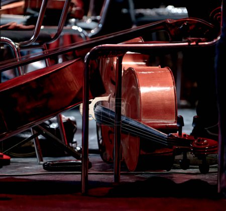 Photo for An image of a cello lies during intermission on the theater stage - Royalty Free Image