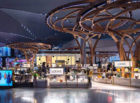 Photo for TURKEY, ISTANBUL, 25, FEBRUARY, 2023: Modern Ataturk Istanbul International airport interior with many fashion brand store in Duty Free, Istanbul. Turkey - Royalty Free Image