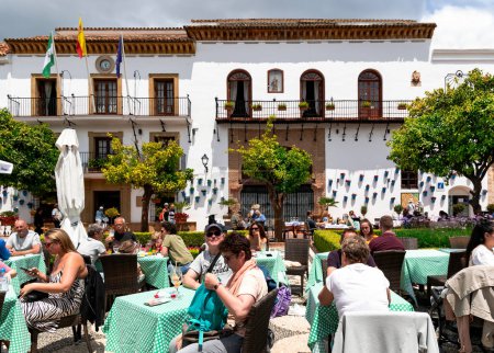 Photo for SPAIN, MARBELLA, 25, MAY, 2023: People relaxing at street cafes in Orange Square - Plaza de los Naranjos in the Marbella Old Town, Spain - Royalty Free Image