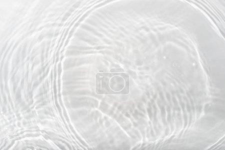 Téléchargez les photos : Water panoramic banner background. Water texture; water surface with rings and ripple. Spa concept background. Flat lay; top view; copy space; composition with copy-space. - en image libre de droit