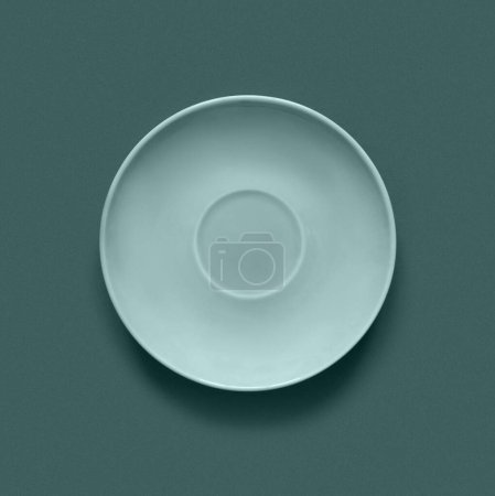 Photo for Turquoise color plates on turquoise table. Monochrome minimalistic image in hipster style - Royalty Free Image