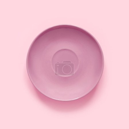 Photo for Pink plates on pink table. Monochrome minimalistic image in hipster style - Royalty Free Image