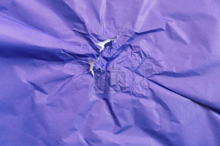 Old used crumpled wrapping paper. Creative blue abstract background.