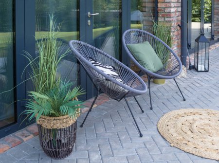 Photo for Two garden chairs on the summer terrace. - Royalty Free Image